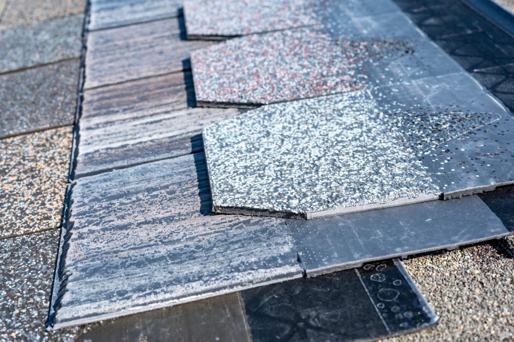 Plastic roof shingles